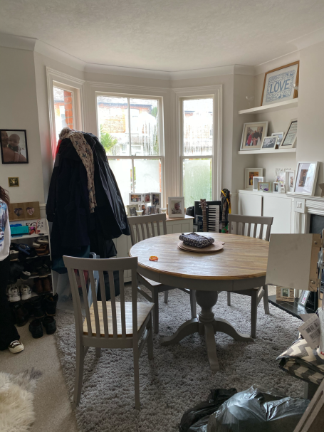 A chaotic, cluttered room reflecting the overwhelm and mental fatigue caused by disorganized environments.
